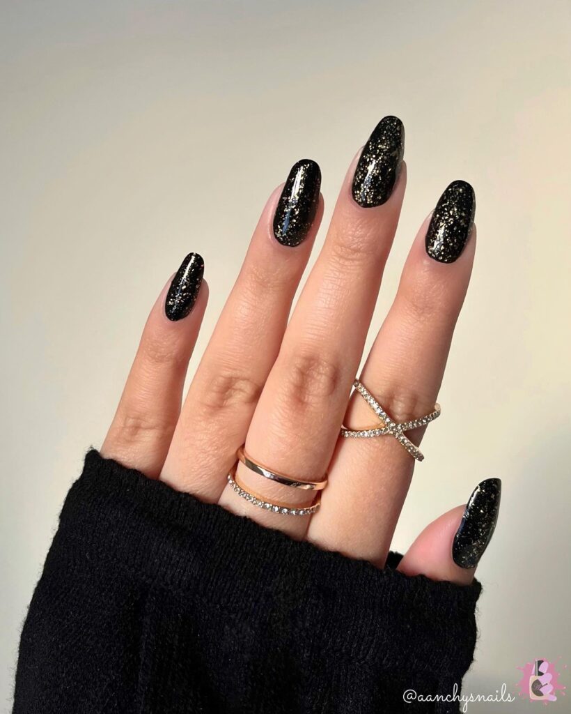 black and gold glitter new years nails