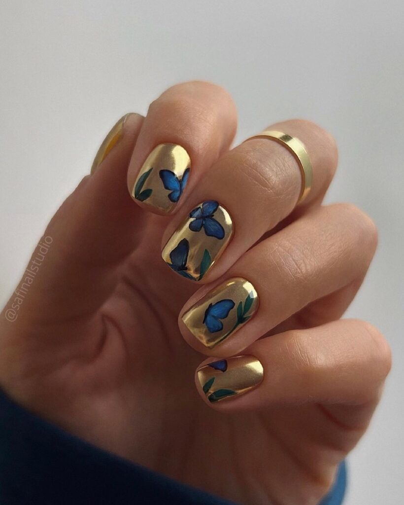 gold and blue butterfly nails