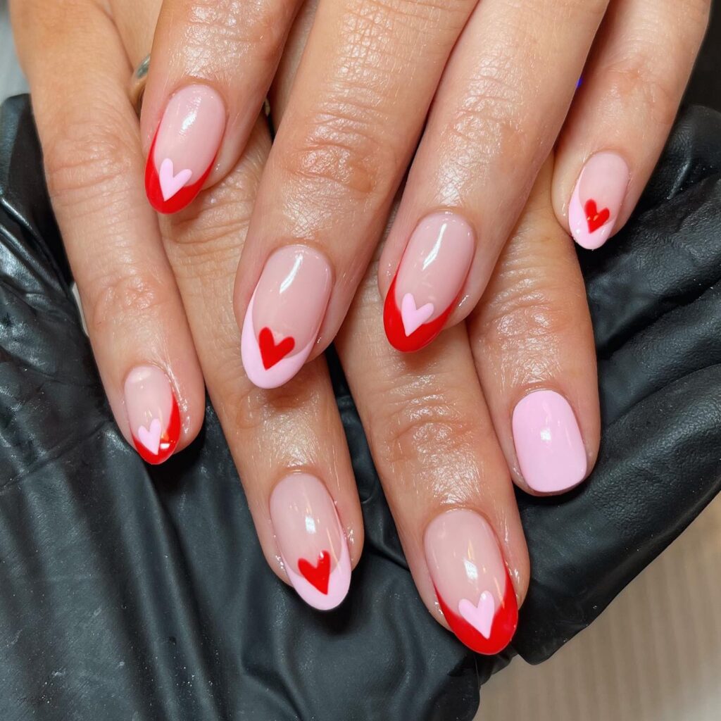 red and pink French tips with hearts nails