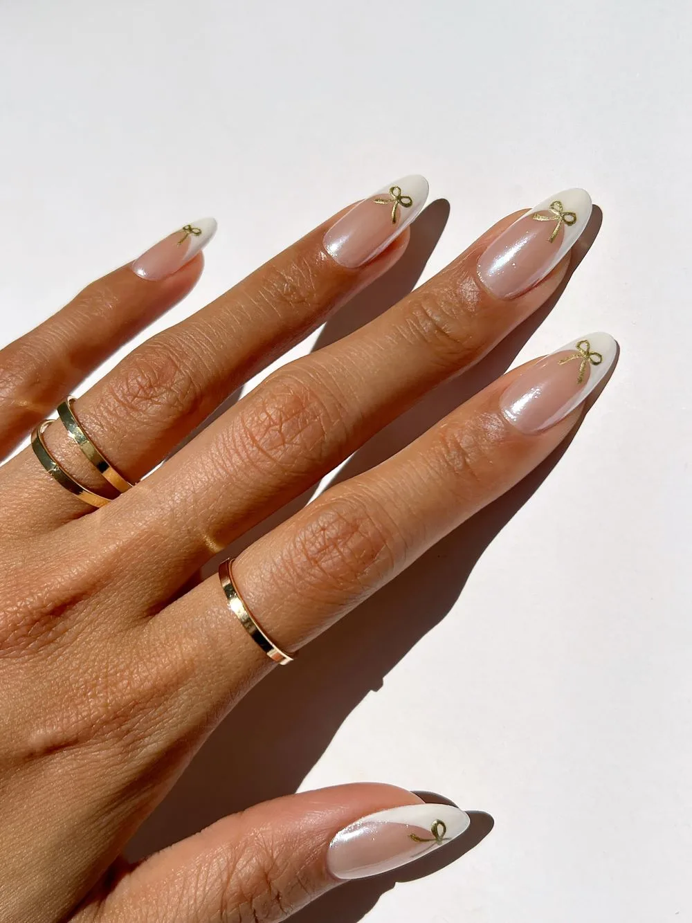 chrome french tip nails with ballet bows