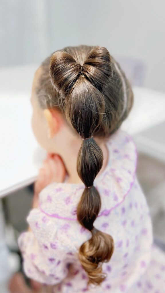 bubble braid pigtails with bow back to school hairstyles