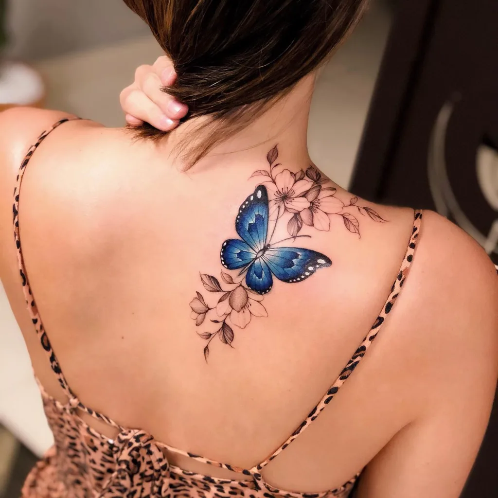 blue butterfly back tattoo