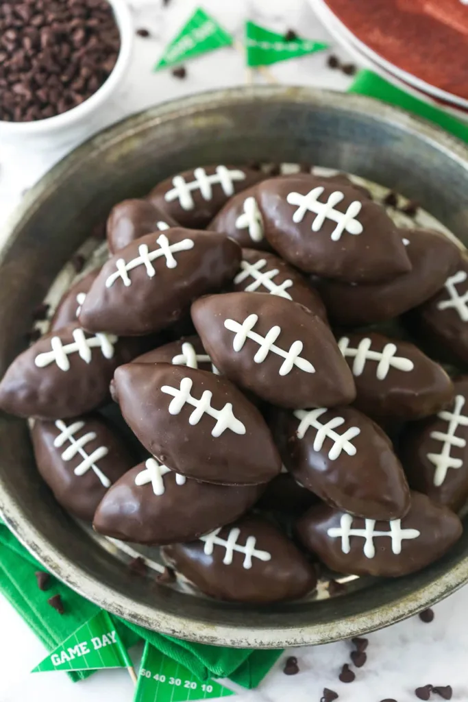 football-shaped chocolate-covered cookie dough treats with white icing laces