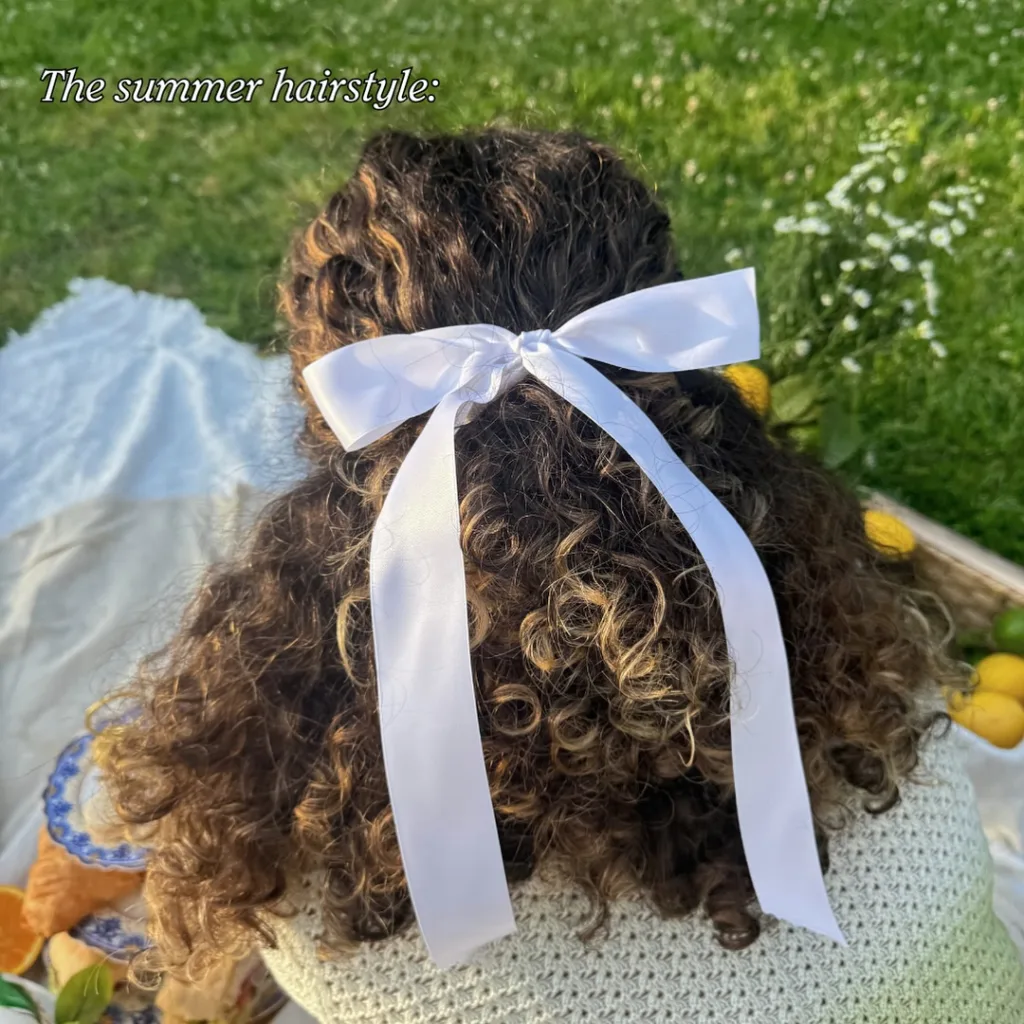 curly half up half down hairstyle