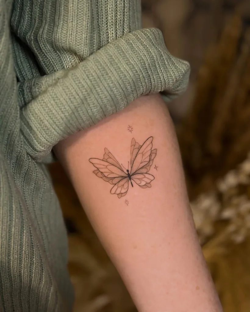 fine line butterfly tattoo on arm