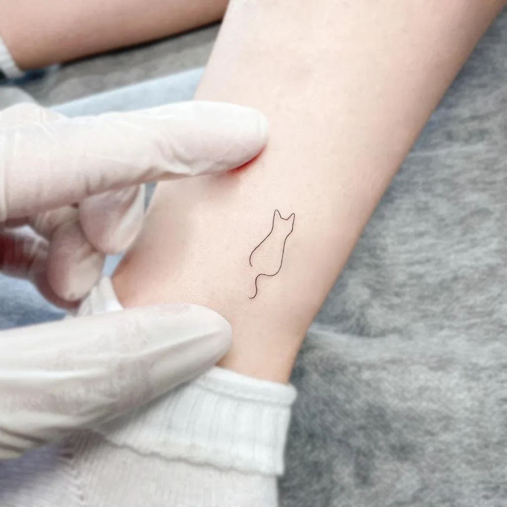 fine line cat tattoo