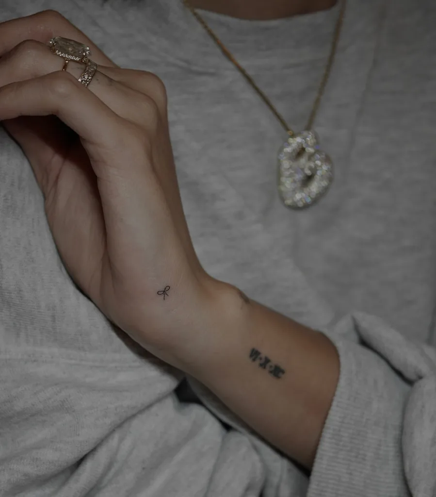 micro bow tattoo