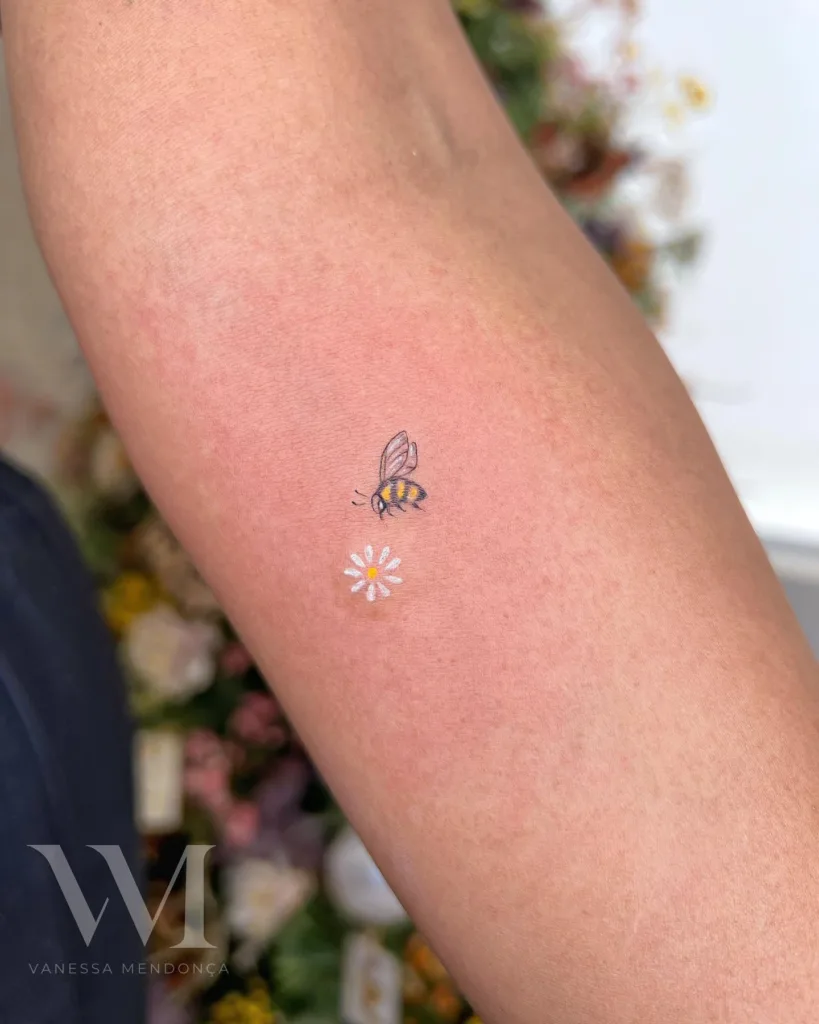 mini bee and flower tattoo