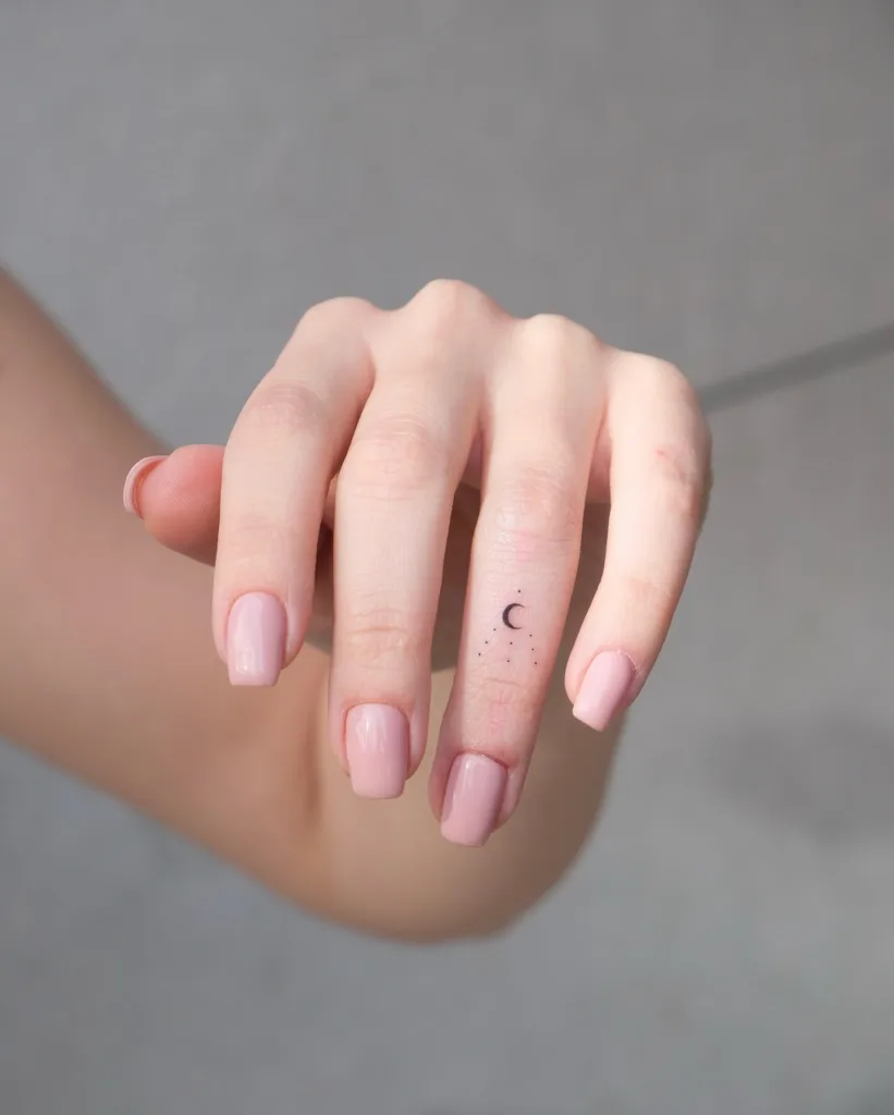 mini moon finger tattoo