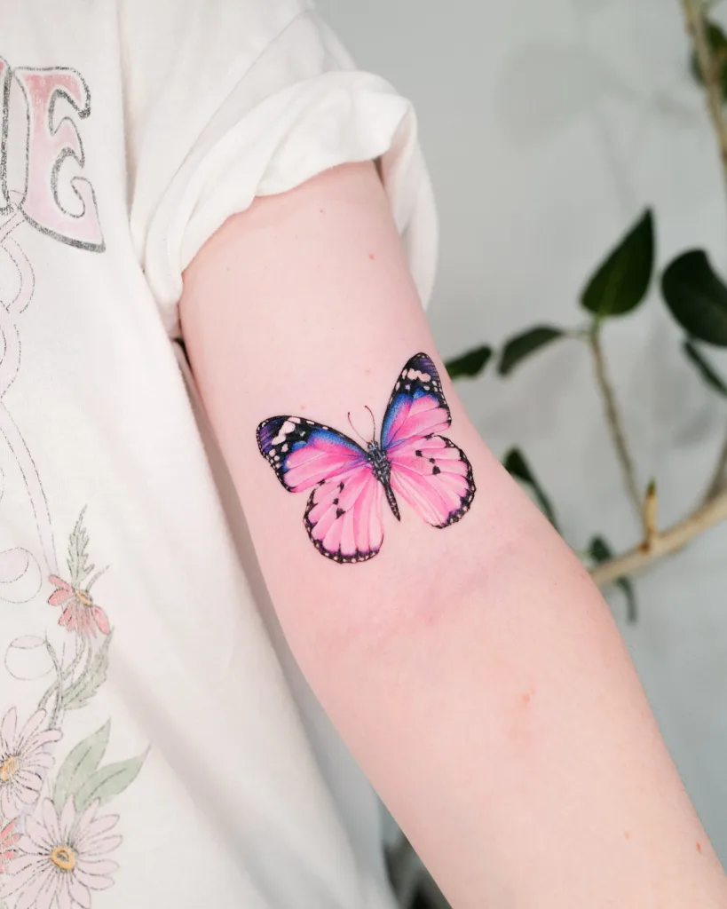 pink upper arm butterfly