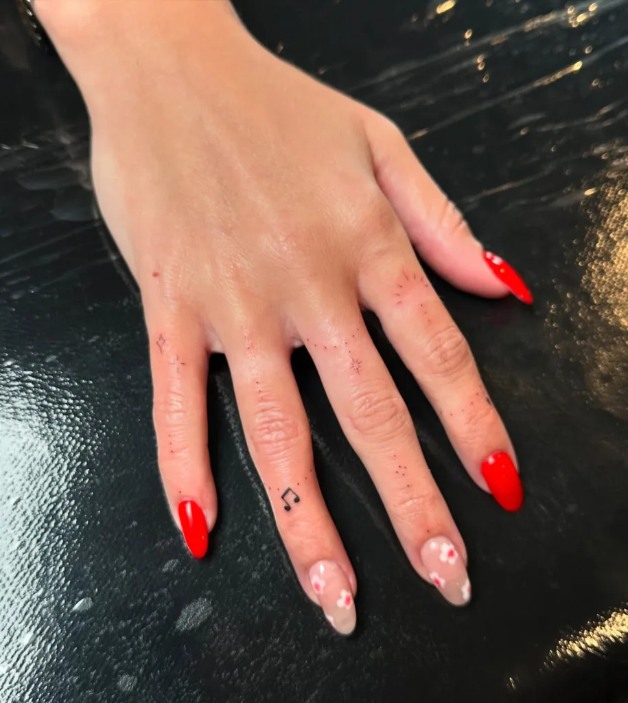small finger music note tattoo