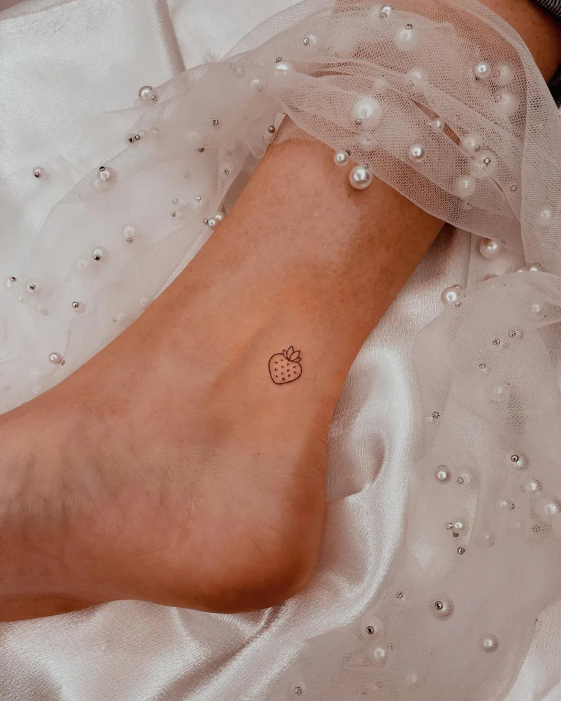 sweet little strawberry tattoo