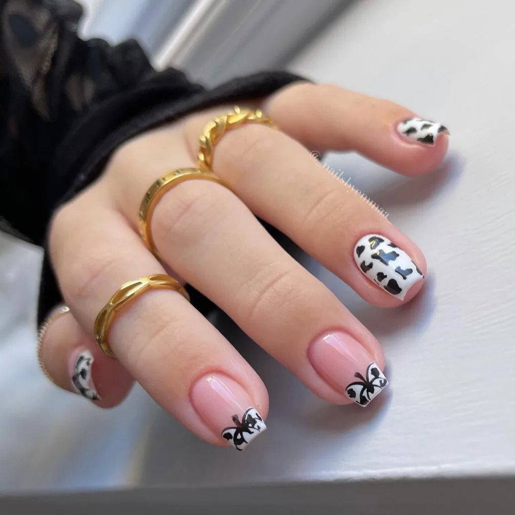 cow print pumpkin nails