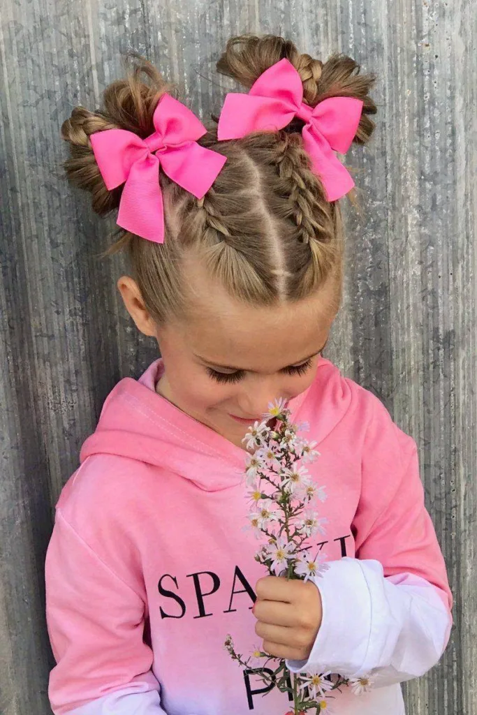 dutch braids into messy space buns