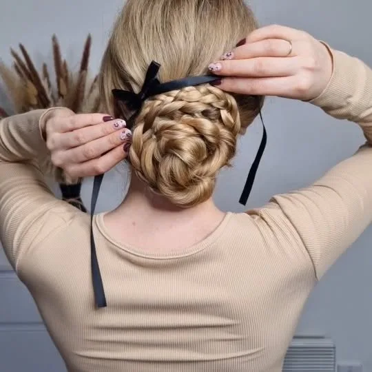 braided low bun with ribbon