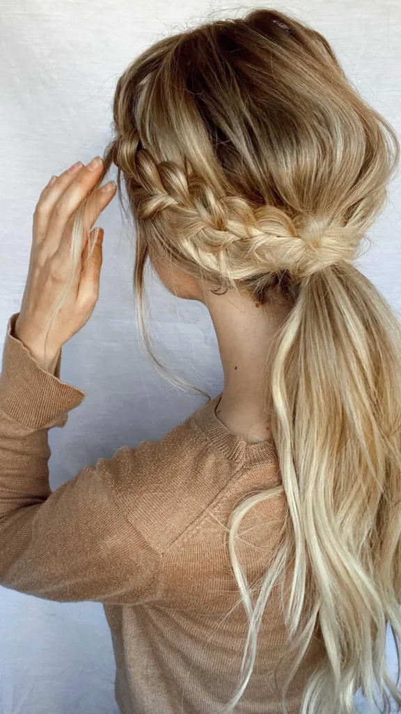 side dutch braids into low ponytail