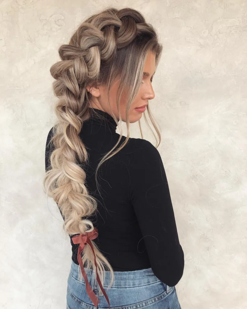voluminous side braid with ribbon
