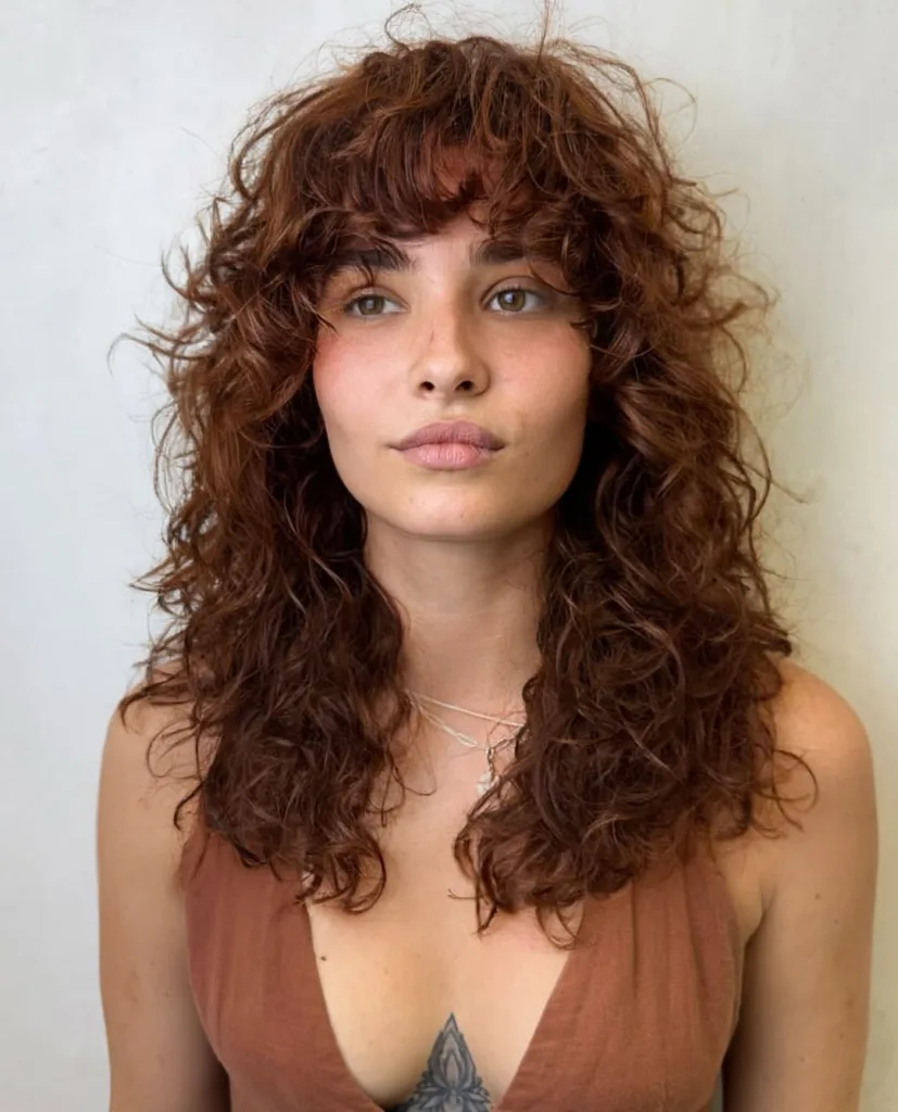 curly auburn wolf cut with fringe