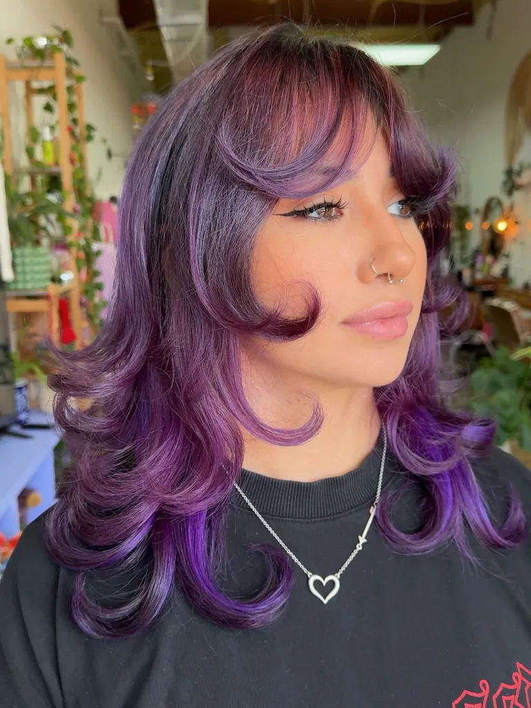 layered purple wolf cut with curled ends
