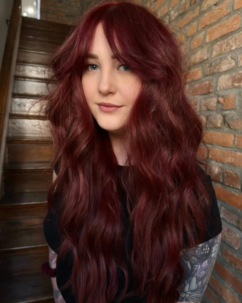 long red wolf cut with curtain bangs