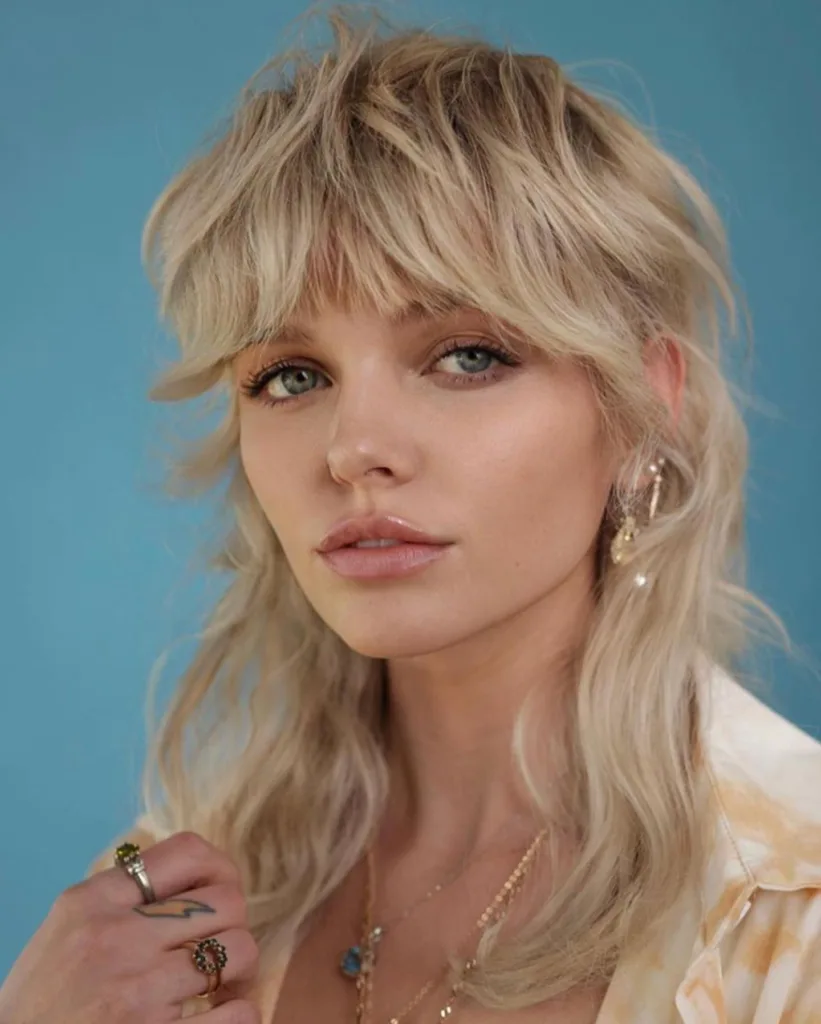 medium-length shaggy wolf cut with curtain bangs