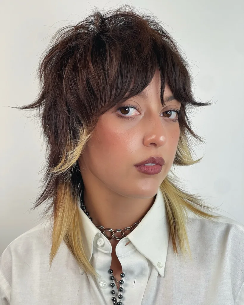 two-tone layered wolf cut with face-framing highlights