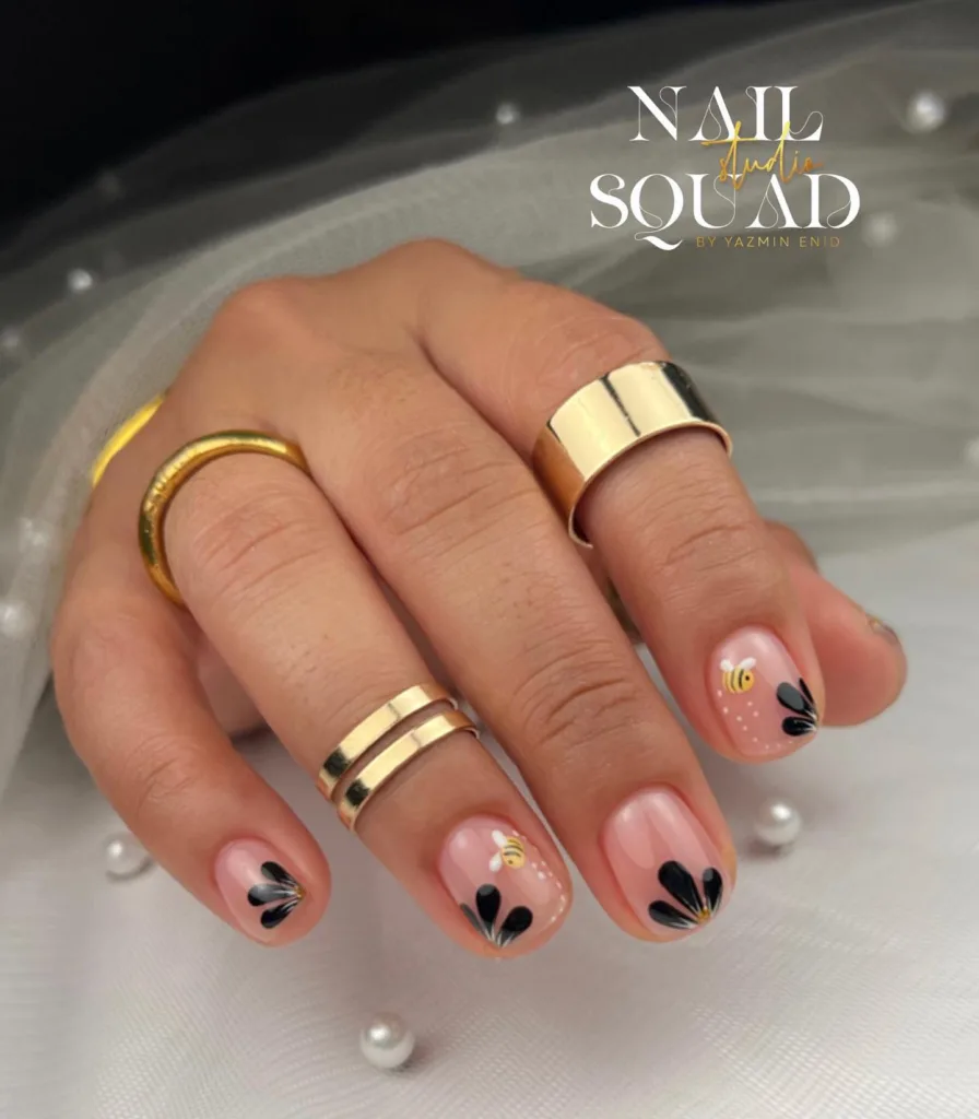 black floral bee nails