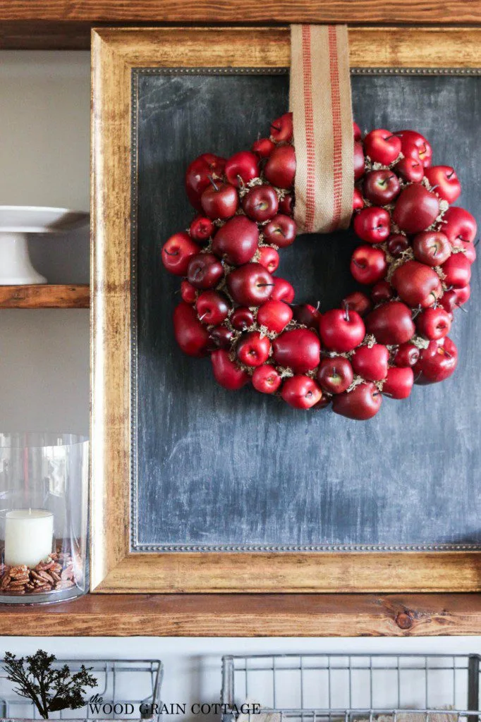 red apple wreath with burlap ribbon for a simple fall decorating craft