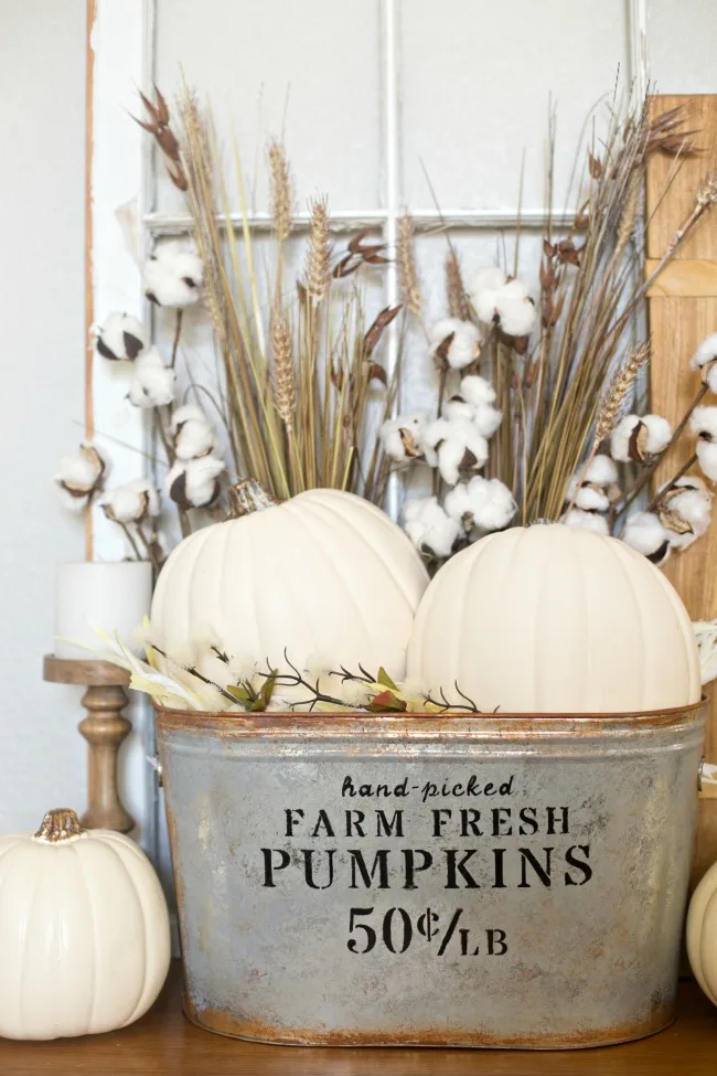 farmhouse pumpkin bucket with white pumpkins for easy fall crafts and rustic decor